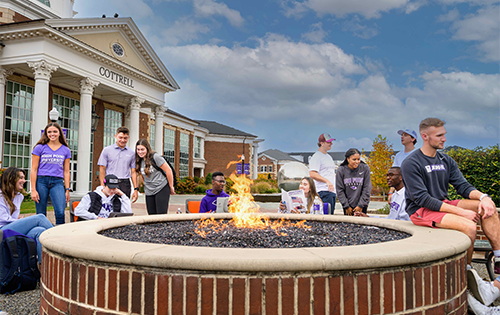 students at fire pit